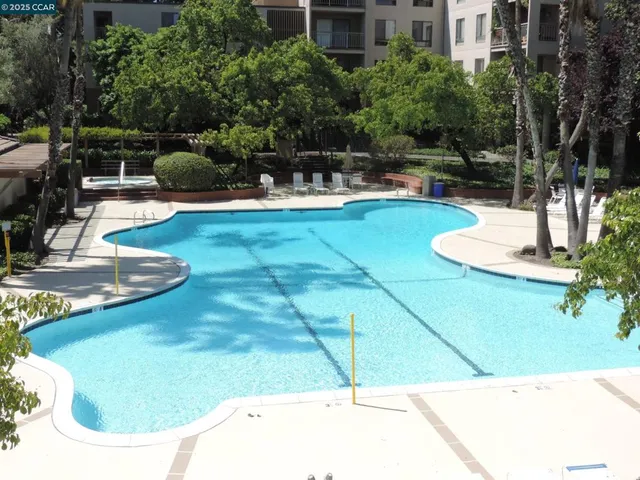 a view of a swimming pool with a patio
