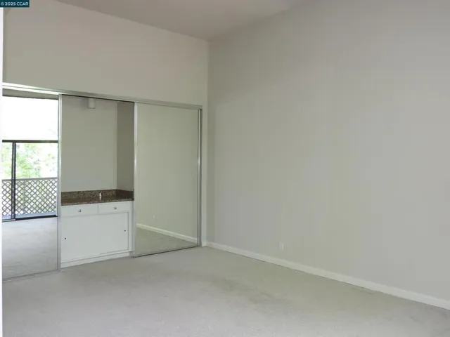 a kitchen with a refrigerator stove and microwave