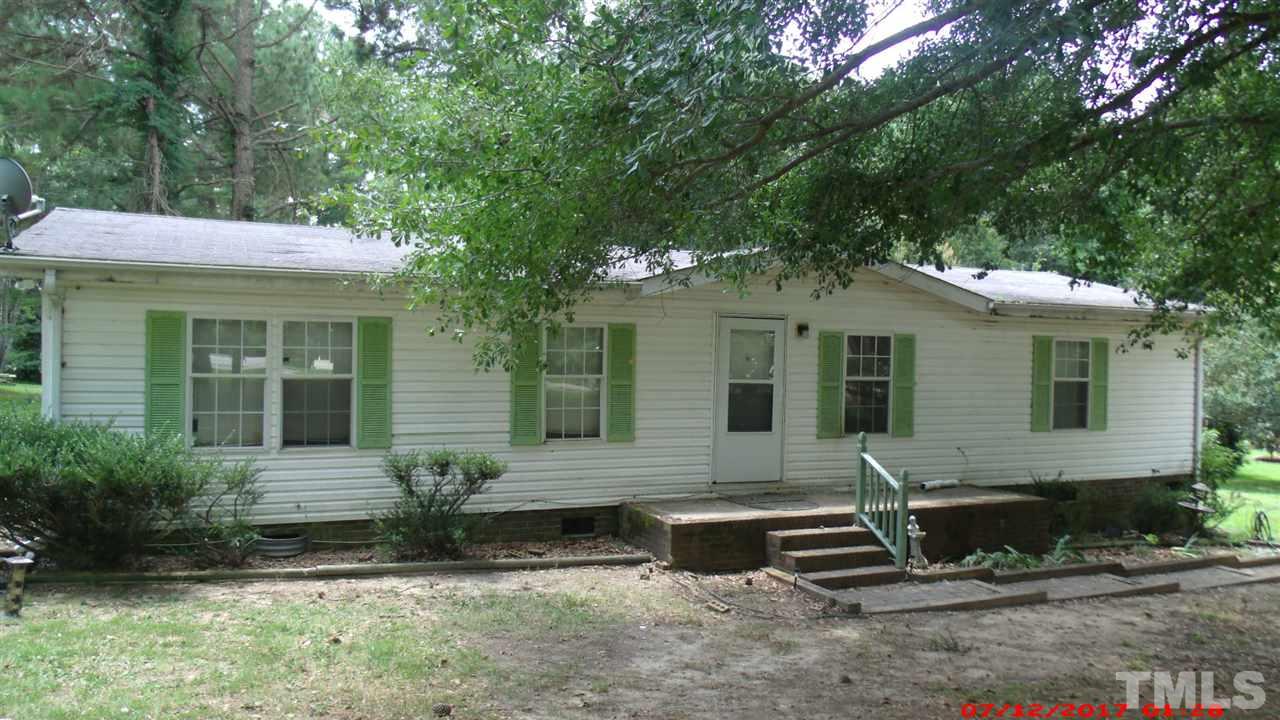 1129 Taos Trail Raleigh, NC 27603 - Photo 1 of 10 a view of a house with a yard