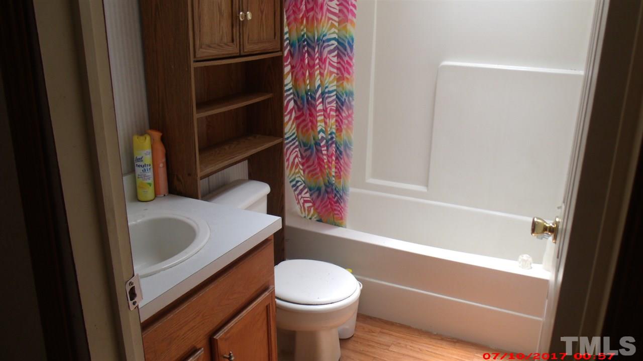 1129 Taos Trail Raleigh, NC 27603 - Photo 9 of 10 a bathroom with a sink toilet and bathtub