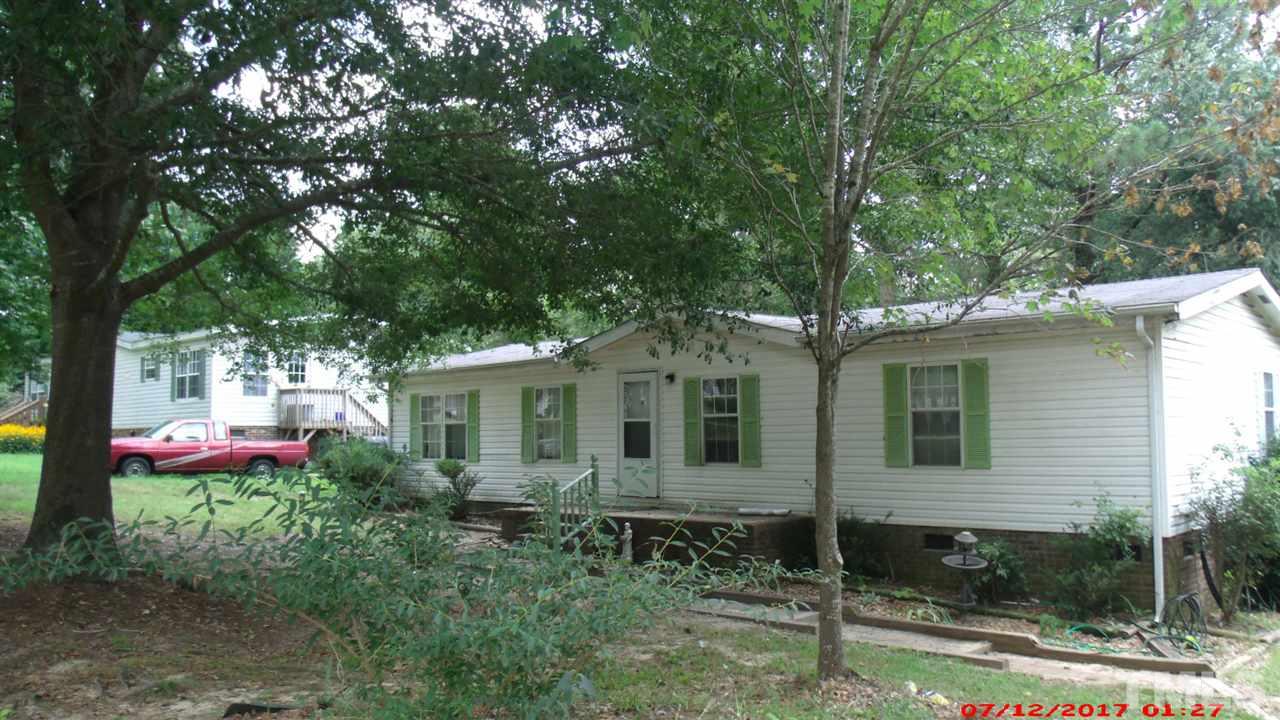 1129 Taos Trail Raleigh, NC 27603 - Photo 10 of 10 a front view of a house with yard