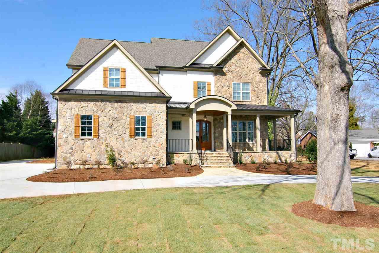 4011 Edwards Mill Road Raleigh, NC 27612 - Photo 1 of 25 a front view of a house with a yard