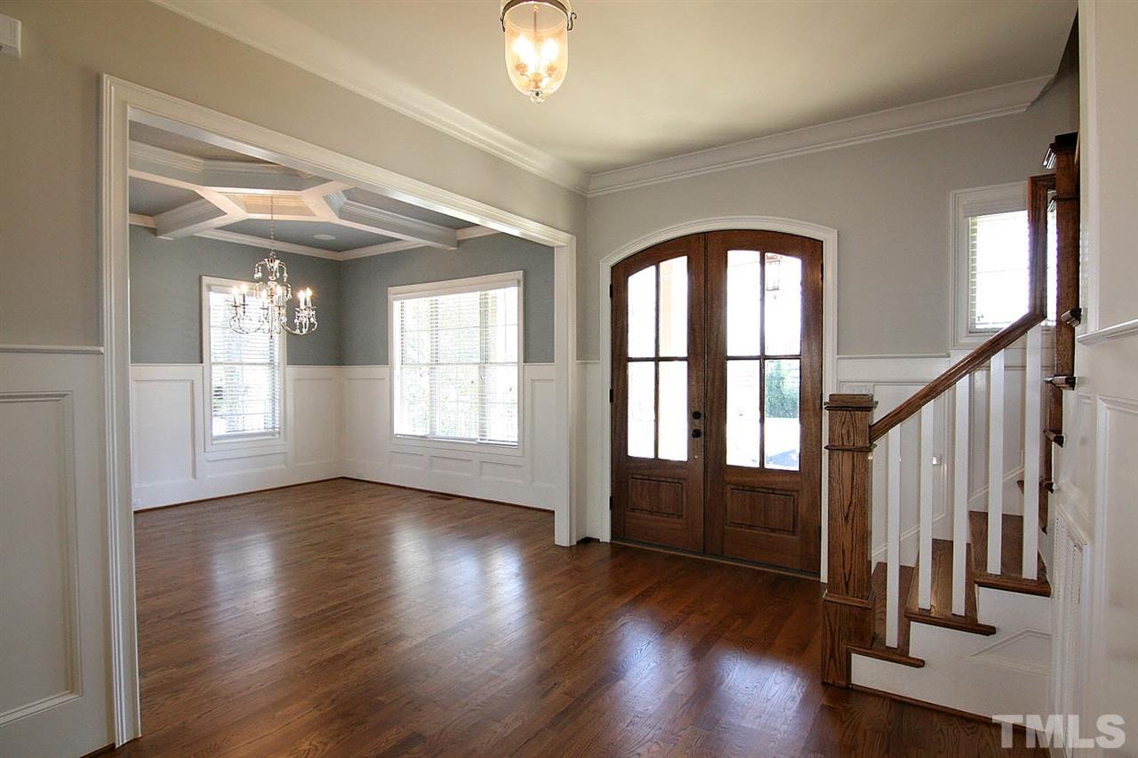 4011 Edwards Mill Road Raleigh, NC 27612 - Photo 11 of 25 a view of an entryway with wooden floor and door