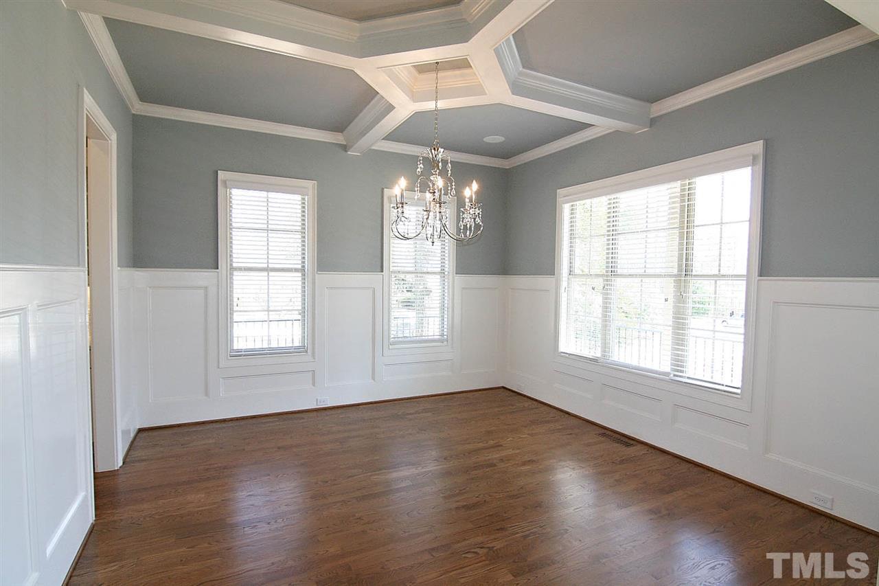 4011 Edwards Mill Road Raleigh, NC 27612 - Photo 12 of 25 an empty room with wooden floor and windows