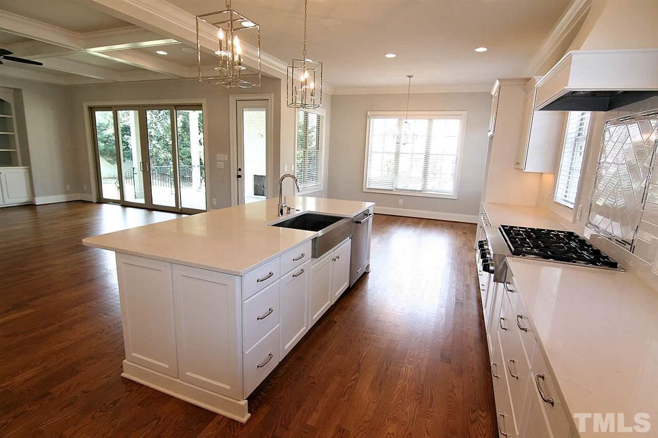 4011 Edwards Mill Road Raleigh, NC 27612 - Photo 13 of 25 a large white kitchen with a large window