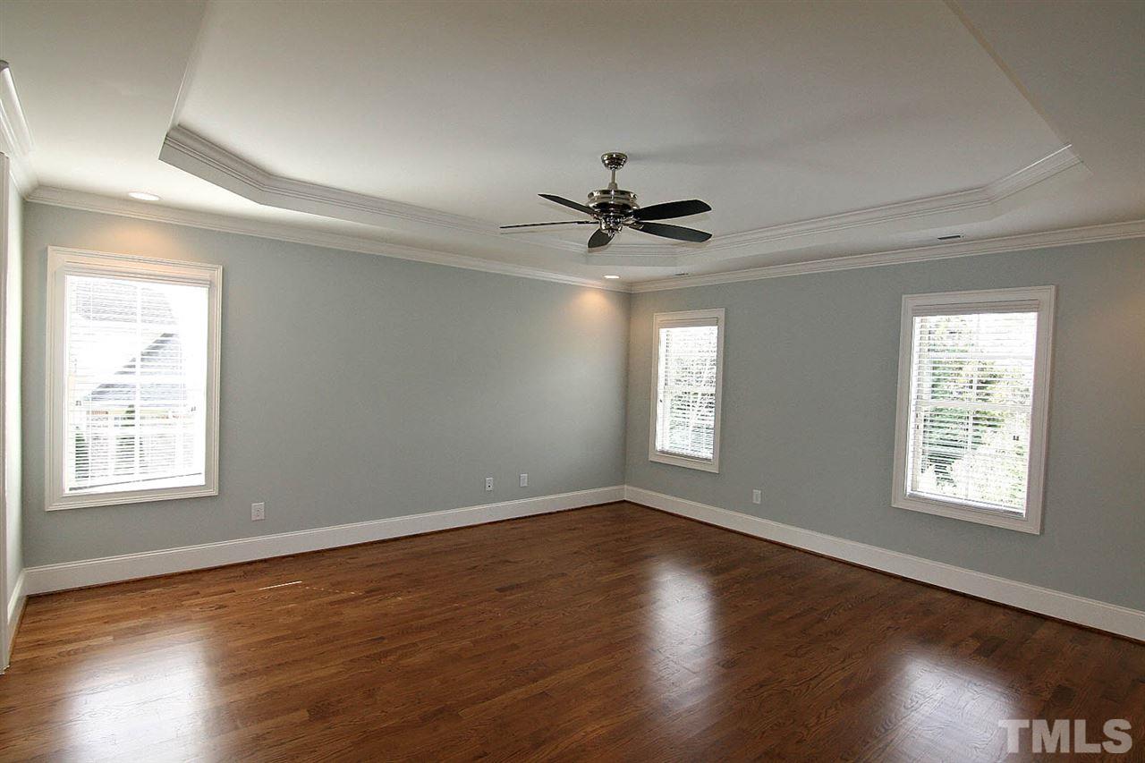 4011 Edwards Mill Road Raleigh, NC 27612 - Photo 19 of 25 a view of an empty room with wooden floor and a window