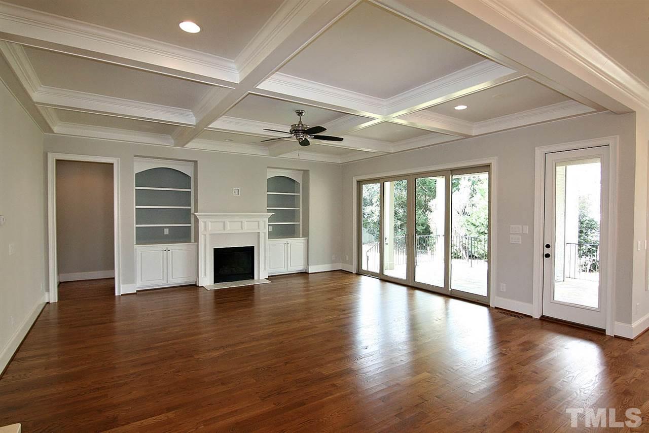 4011 Edwards Mill Road Raleigh, NC 27612 - Photo 3 of 25 a view of an empty room with wooden floor and a window