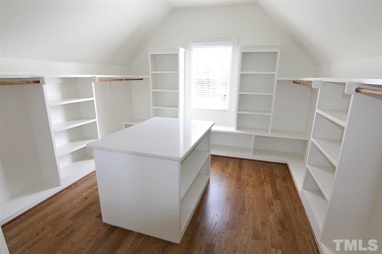 4011 Edwards Mill Road Raleigh, NC 27612 - Photo 21 of 25 a view of walk in closet with empty racks