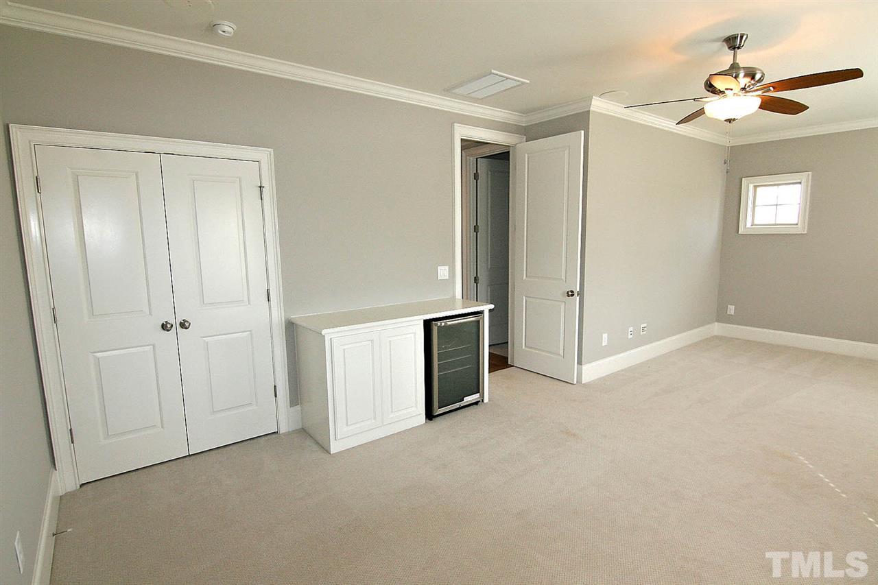 4011 Edwards Mill Road Raleigh, NC 27612 - Photo 22 of 25 a view of empty room with a ceiling fan