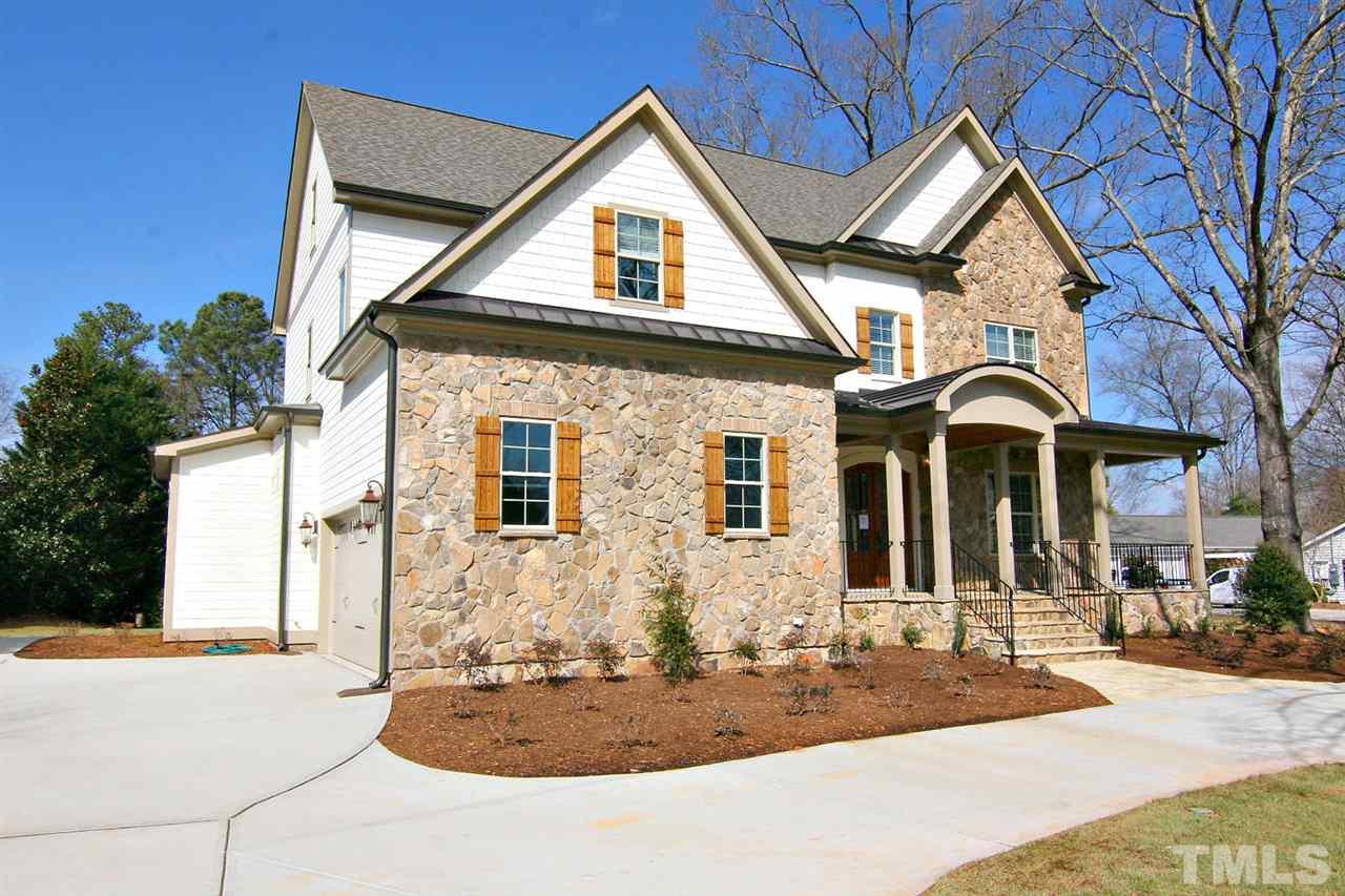 4011 Edwards Mill Road Raleigh, NC 27612 - Photo 6 of 25 a front view of a house with garden