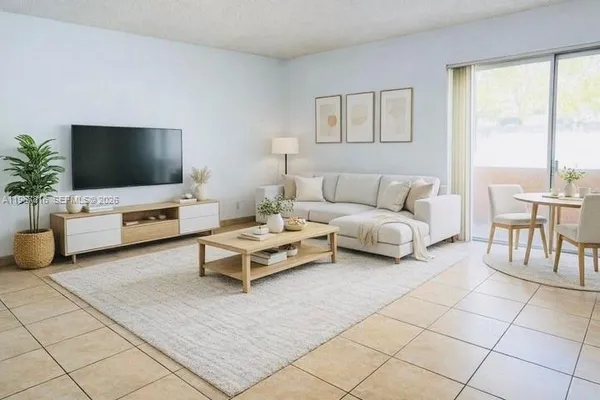a living room with furniture and a flat screen tv