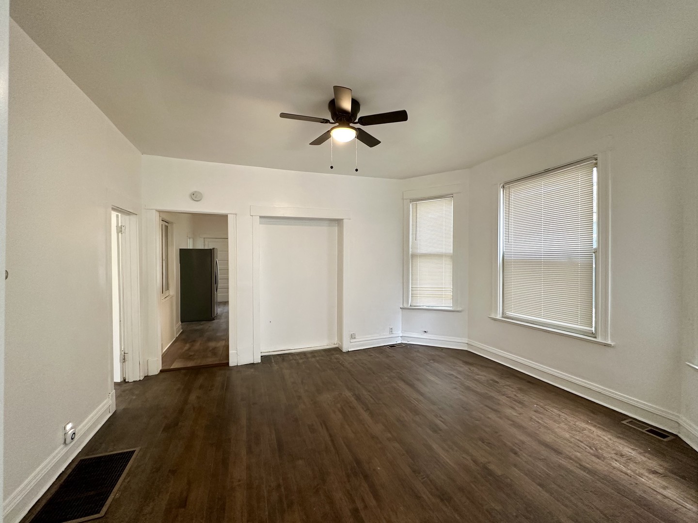 10749 South State Street Chicago, IL 60628 - Photo 8 of 31 wooden floor in an empty room with a window