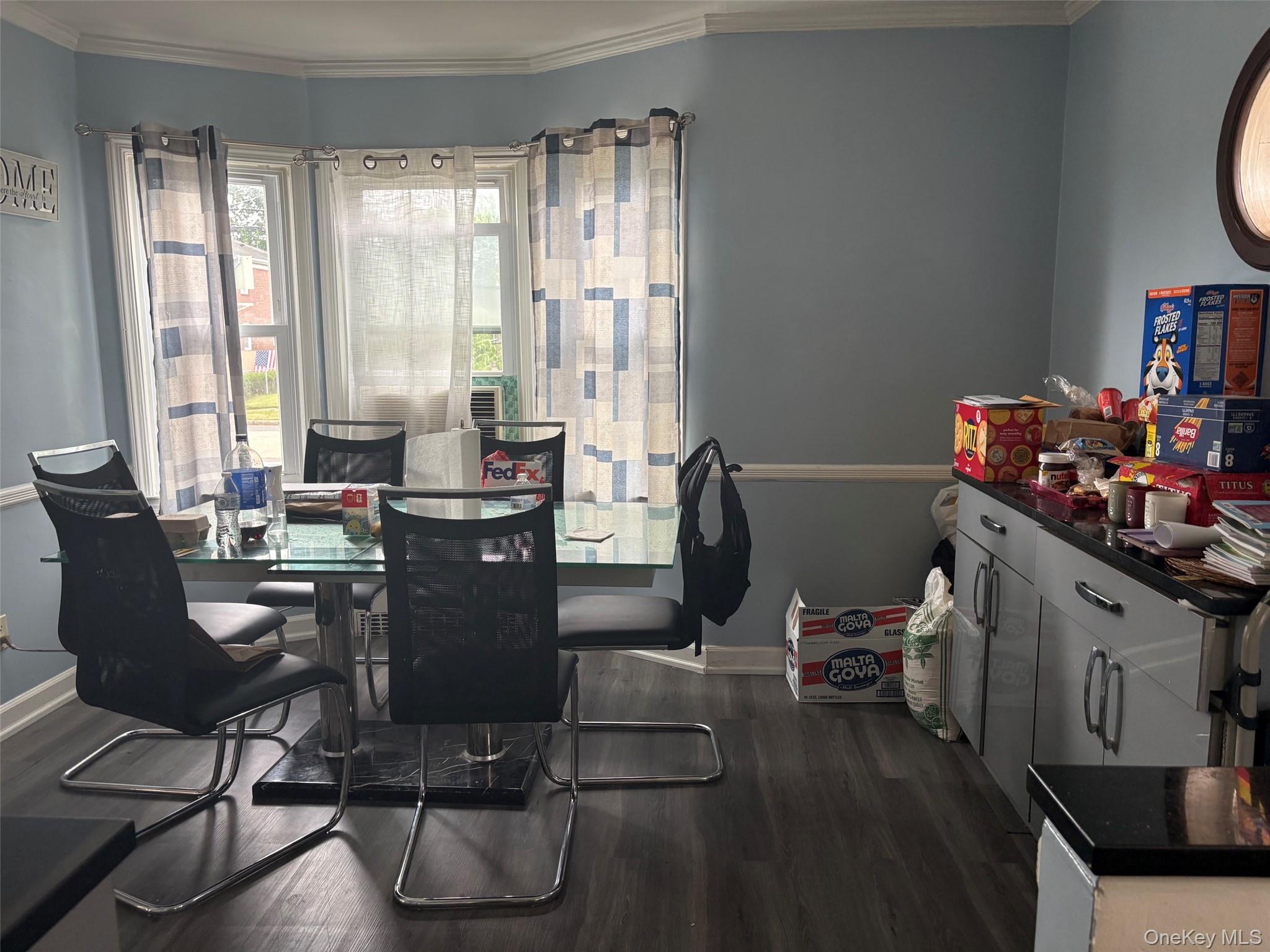 91 Broadway Valley Stream, NY 11580 - Photo 6 of 12 a view of a dining room with furniture window and outside view