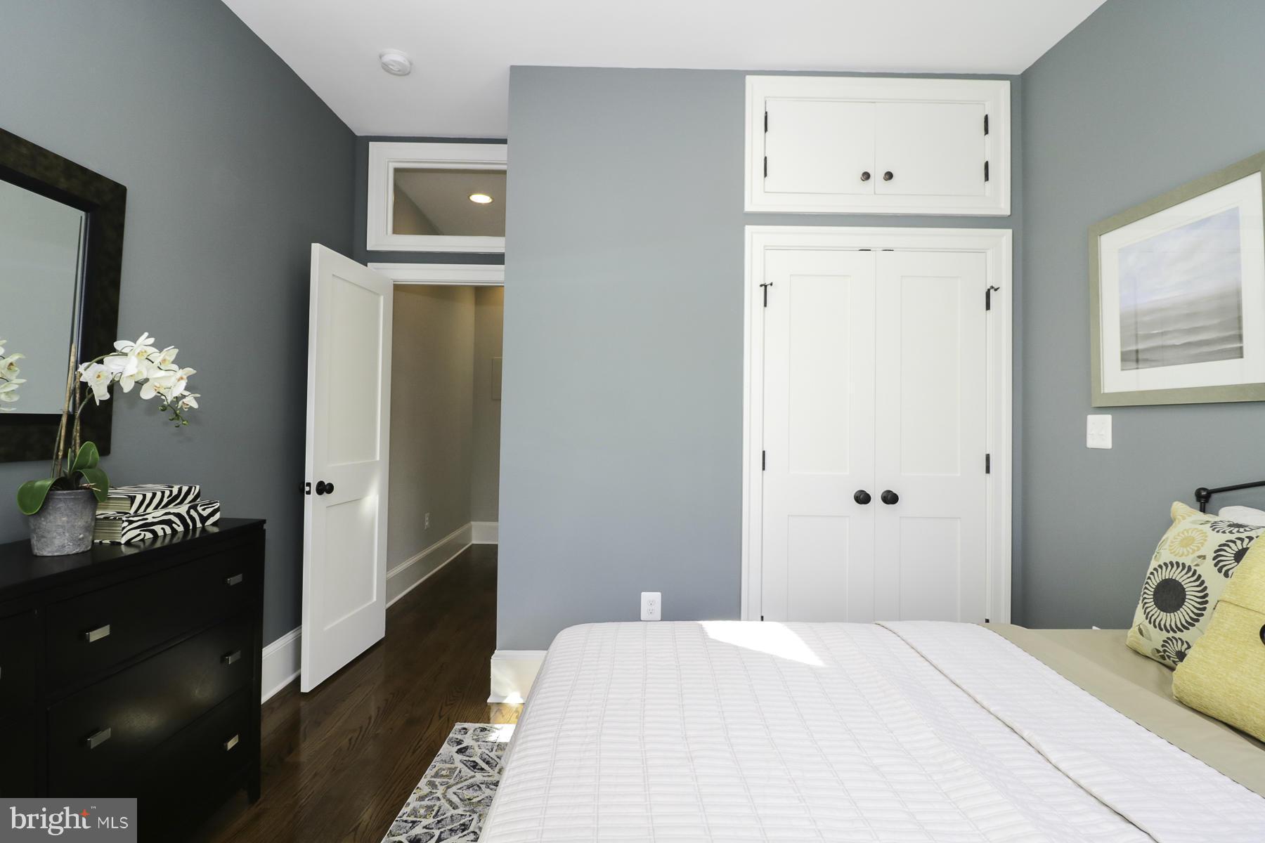 124 11th Street Northeast Washington, DC 20002 - Photo 24 of 30 a bedroom with a bed and a table in it