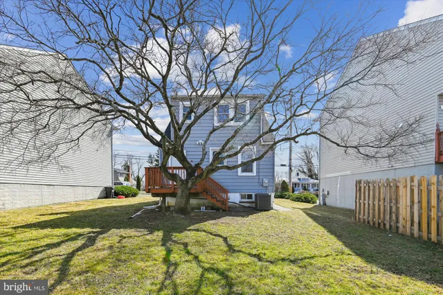 a view of house with yard in snow