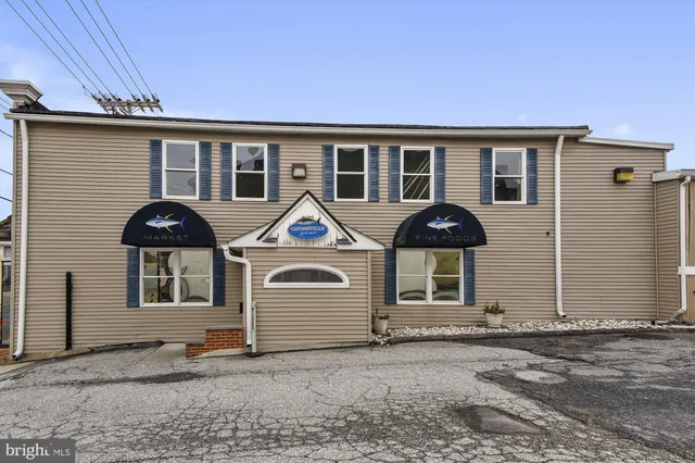 a couple of cars parked in front of a house
