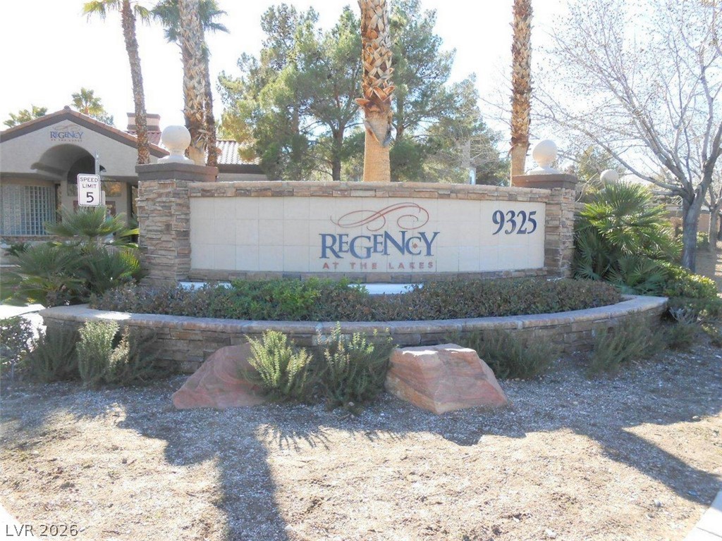9325 West Desert Inn Road, Unit 132 Las Vegas, NV 89117 - Photo 33 of 36 A welcoming stone-clad entrance sign identifies the Regency at The Lakes community.
