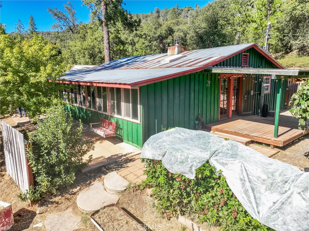 1682 Shany Creek Road Ahwahnee, CA 93601 - Photo 1 of 1 a front view of a house with garden