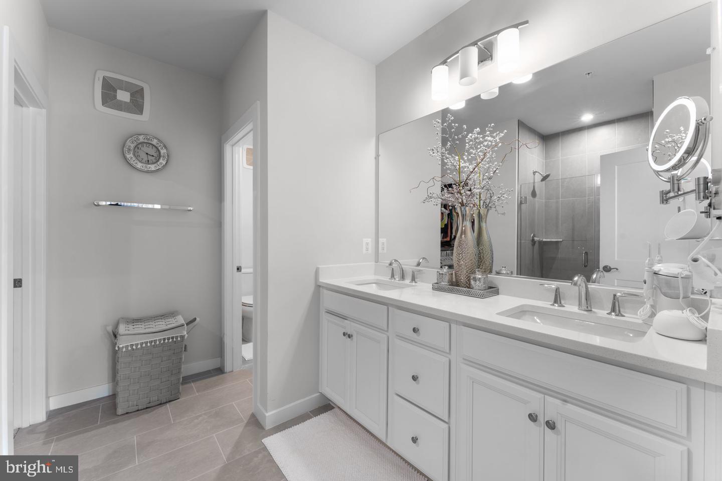 43785 Transit Square Ashburn, VA 20147 - Photo 17 of 40 a bathroom with a double vanity sink and a mirror