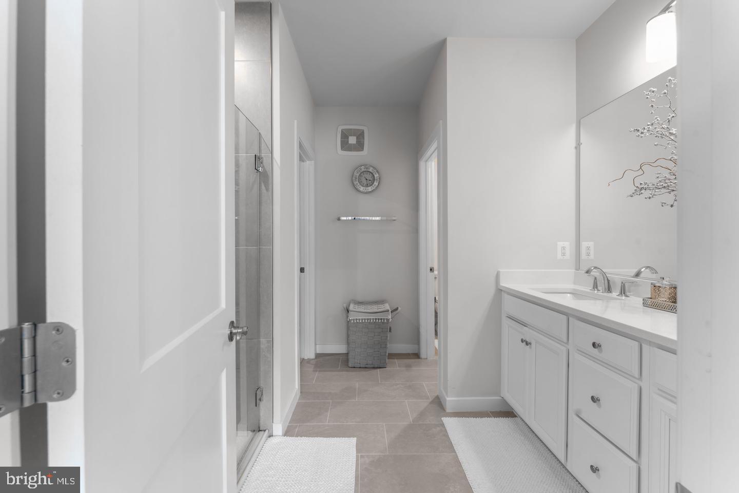 43785 Transit Square Ashburn, VA 20147 - Photo 18 of 40 a bathroom with a double vanity sink toilet and shower