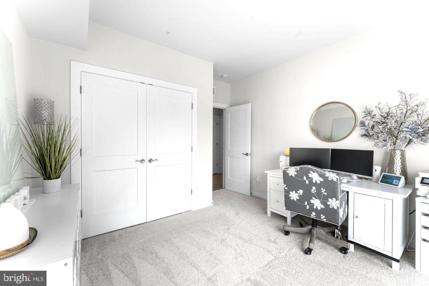 43785 Transit Square Ashburn, VA 20147 - Photo 24 of 40 a view of a bedroom with a workspace