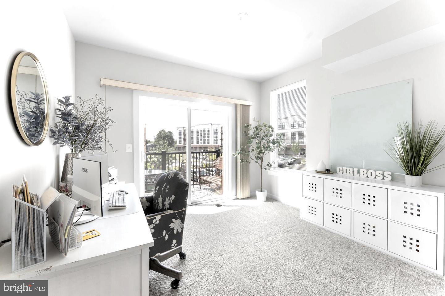 43785 Transit Square Ashburn, VA 20147 - Photo 25 of 40 a living room with furniture a floor to ceiling window and a flat screen tv