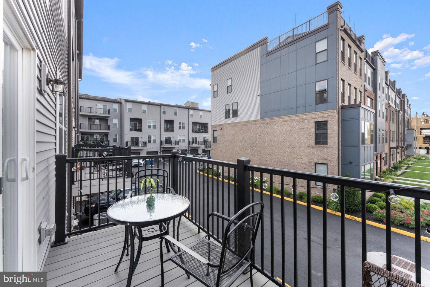 43785 Transit Square Ashburn, VA 20147 - Photo 32 of 40 a view of a balcony with a table and chairs