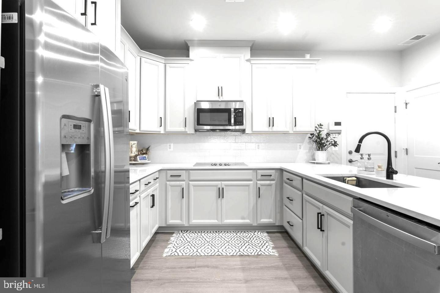 43785 Transit Square Ashburn, VA 20147 - Photo 8 of 40 a kitchen with a sink stove and refrigerator