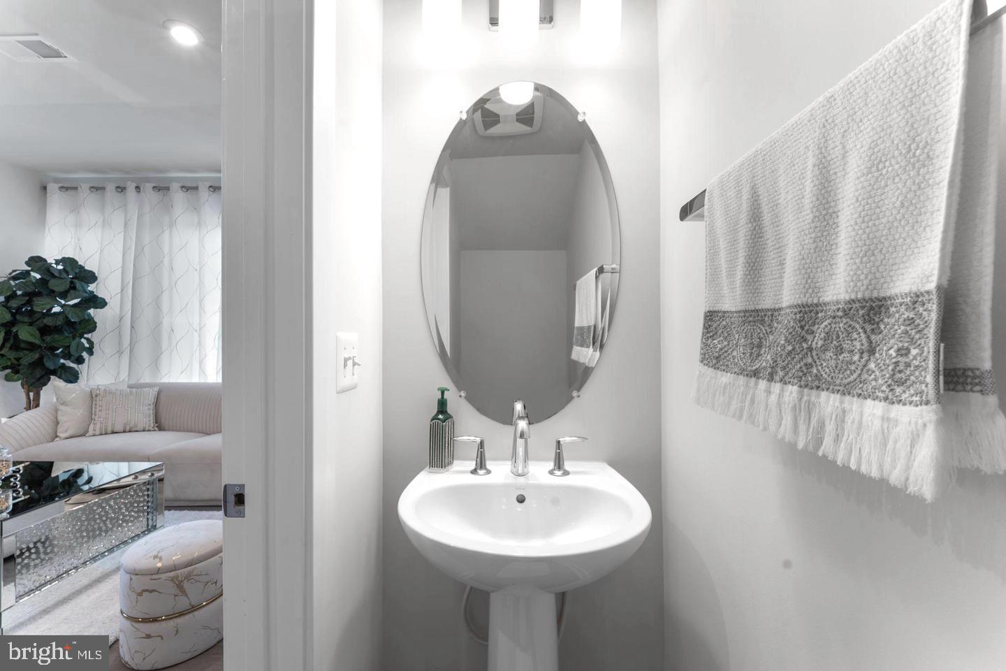 43785 Transit Square Ashburn, VA 20147 - Photo 9 of 40 a bathroom with a sink and a mirror