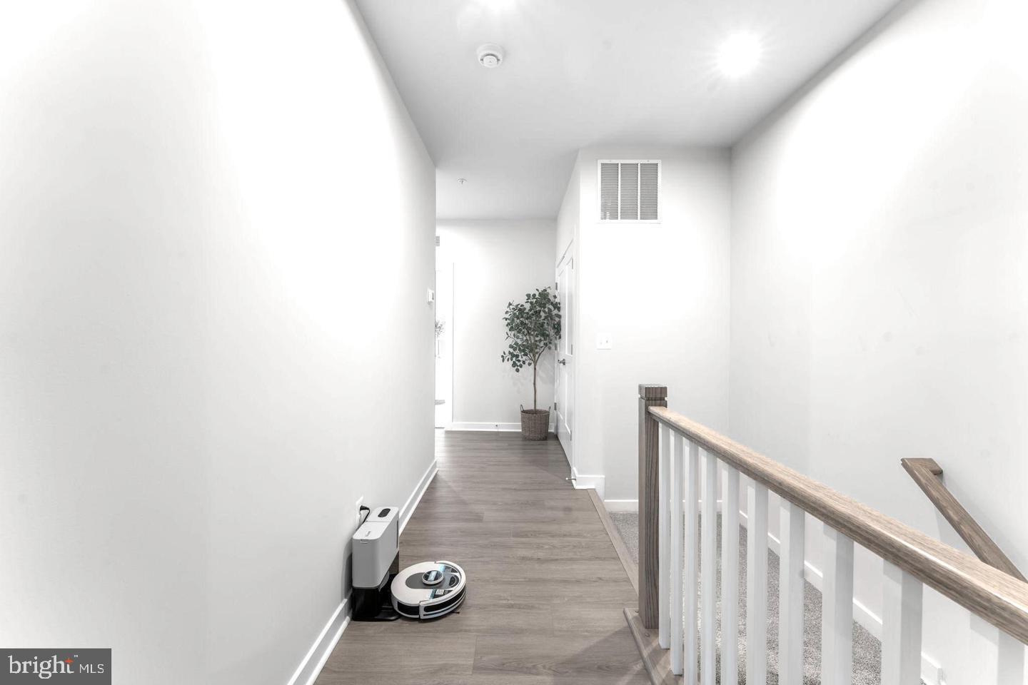 43785 Transit Square Ashburn, VA 20147 - Photo 10 of 40 a view of a hallway with wooden floor