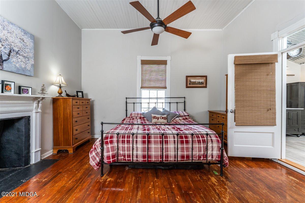 96 Gose Road Forsyth, GA 31029 - Photo 15 of 38 a bedroom with a bed and wooden floor