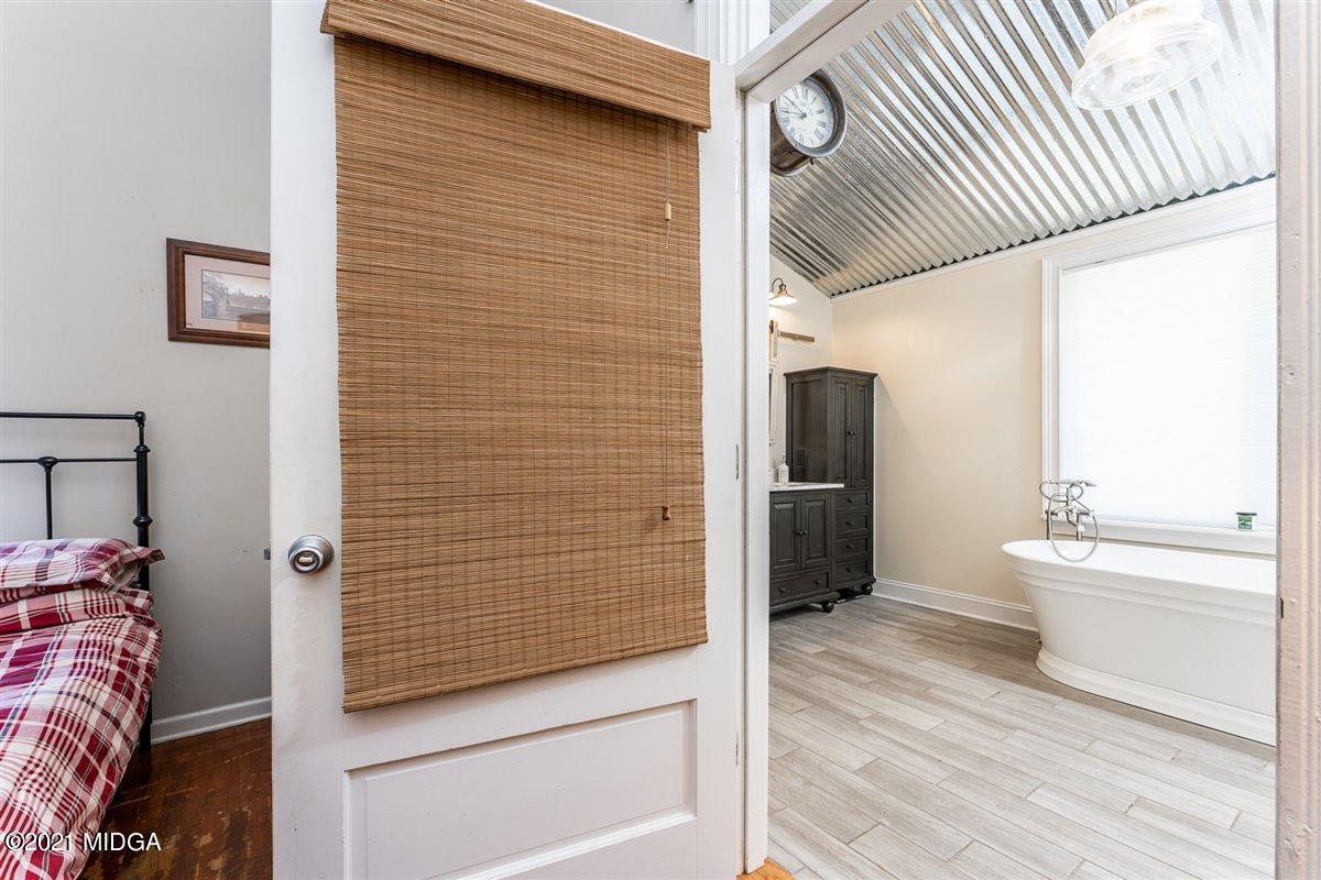 96 Gose Road Forsyth, GA 31029 - Photo 16 of 38 a bathroom with a toilet and a shower