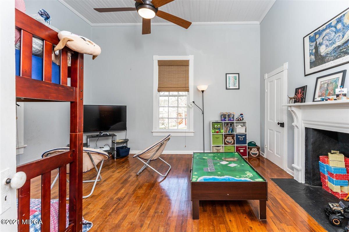 96 Gose Road Forsyth, GA 31029 - Photo 21 of 38 a living room with furniture and a flat screen tv