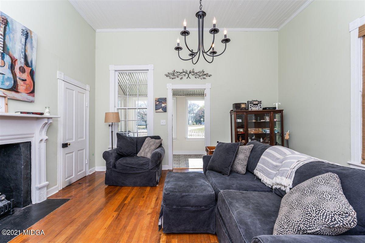 96 Gose Road Forsyth, GA 31029 - Photo 25 of 38 a living room with furniture and a fireplace