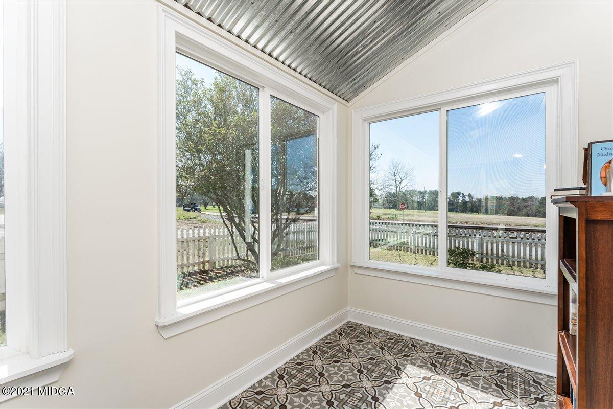 96 Gose Road Forsyth, GA 31029 - Photo 26 of 38 an empty room with wooden floor and windows