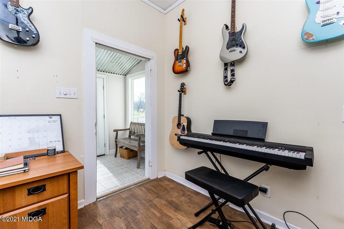 96 Gose Road Forsyth, GA 31029 - Photo 32 of 38 a room with a piano and a table