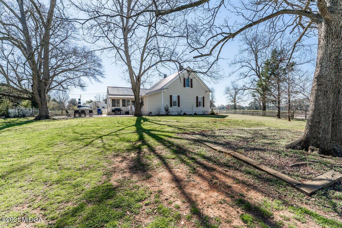 96 Gose Road Forsyth, GA 31029 - Photo 37 of 38 a big house with a big yard and large trees
