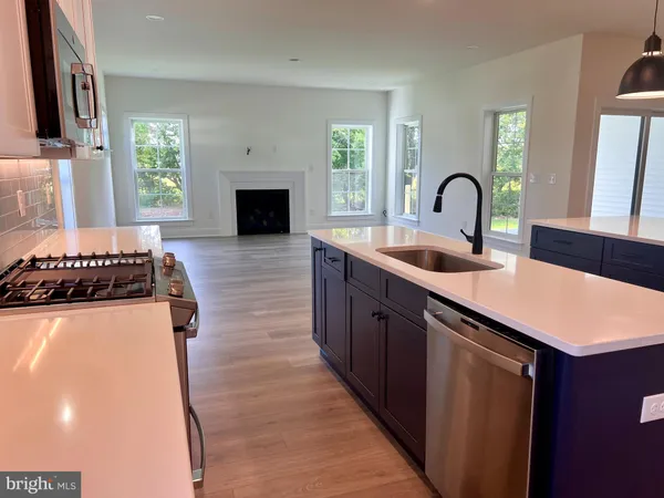 a kitchen with sink and stove