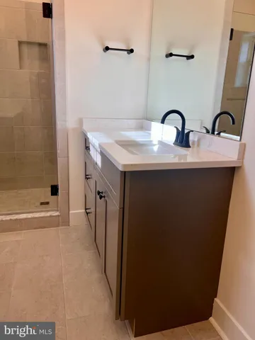 a room with a sink and washing machine