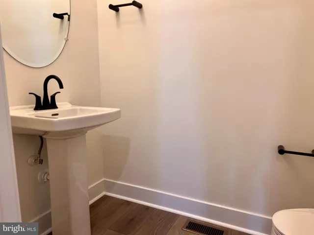 a bathroom with a sink and mirror