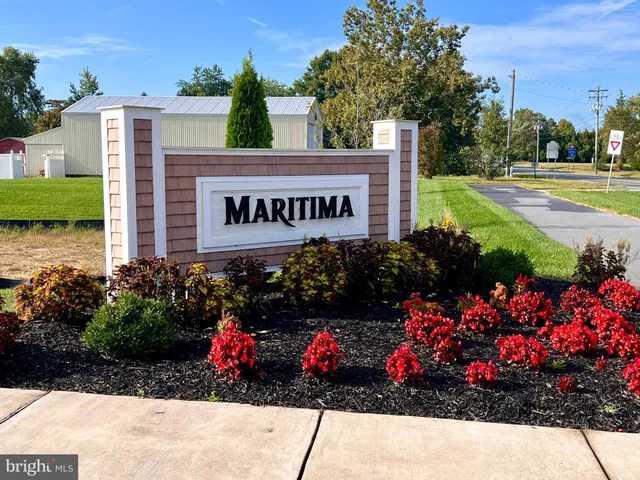 a sign that is in front of flowers