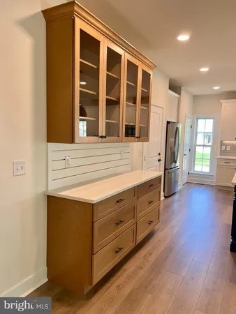 a kitchen with stainless steel appliances granite countertop a stove and a refrigerator