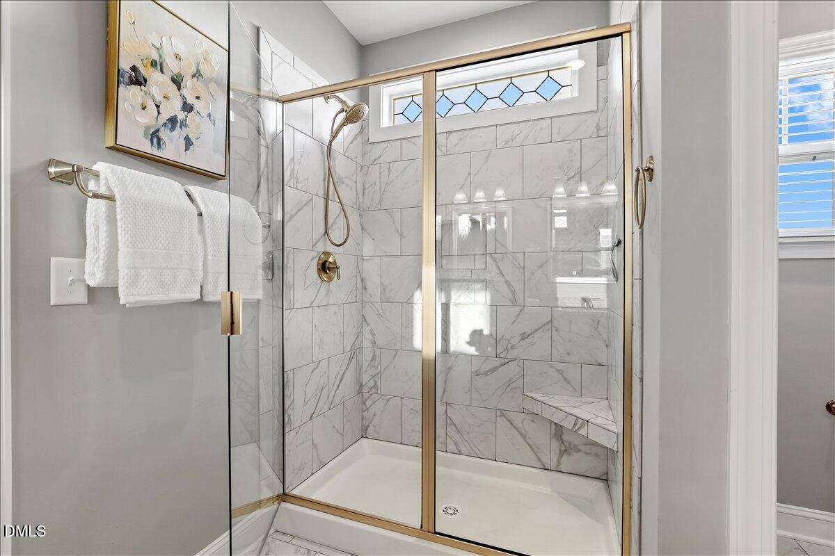 88 Heath Road Lillington, NC 27546 - Photo 13 of 54 a bathroom with a glass shower door