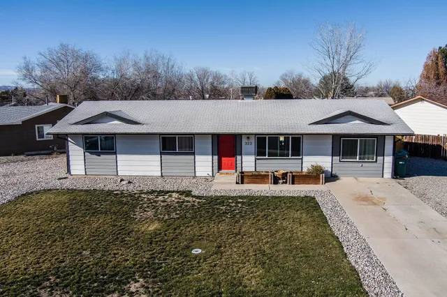 a front view of a house with small garden