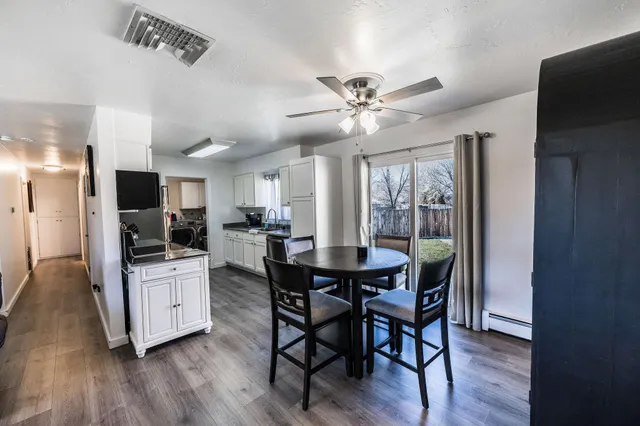 a view of a dining room with furniture window and wooden floor