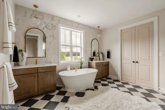 a view of a bathroom with a sink and mirror