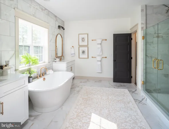 a spacious bathroom with a bathtub and sink
