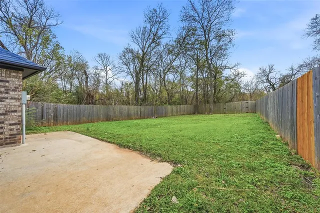 a view of a back yard with green space