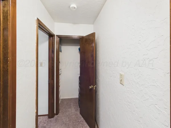 a bedroom with a bed and dresser