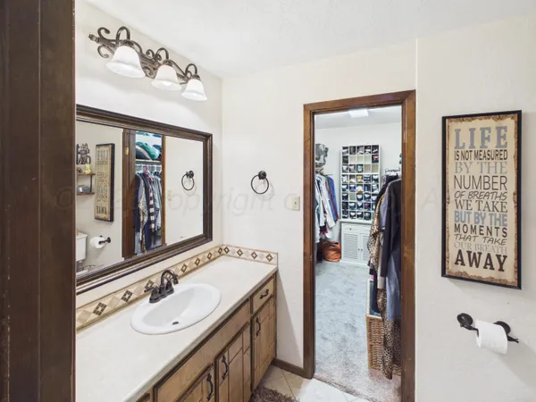 a bathroom with a sink and toilet